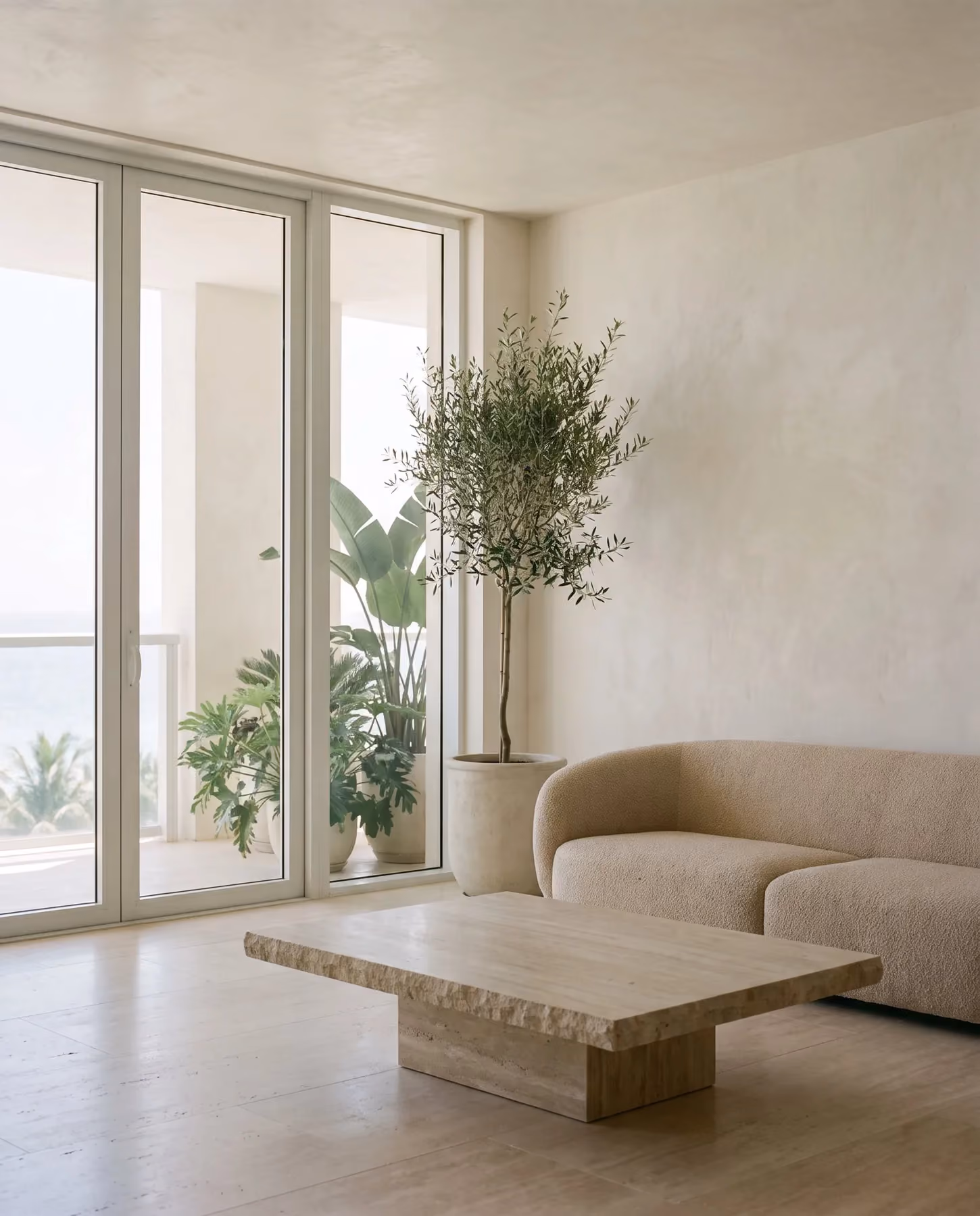 Living room of the two-bedroom corner loft opening to the porch